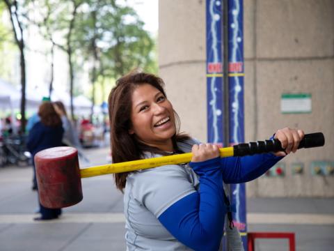 A woman with a sledge hammer